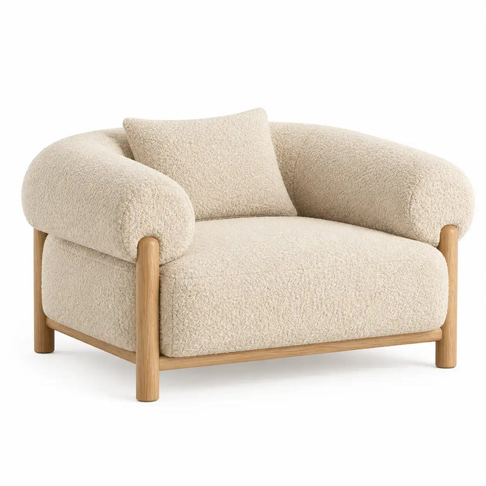 Curved beige and brown armchair from ArchitraveandAbacus, showcasing a stylish design with smooth lines and plush upholstery.